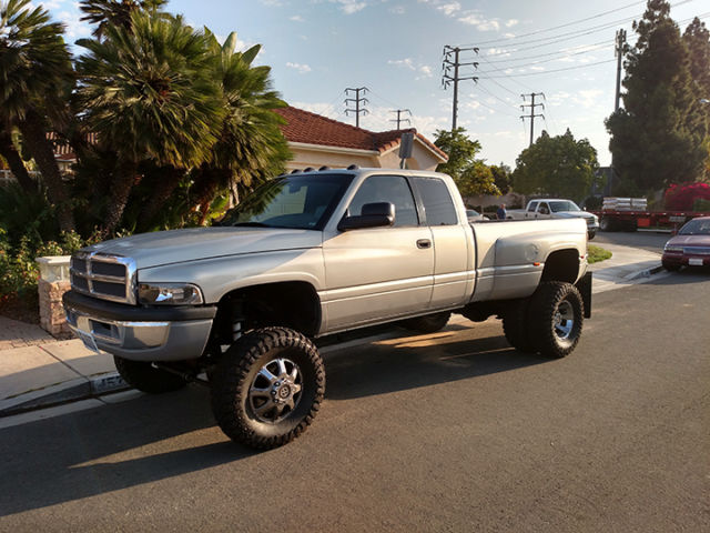 modified dodge ram 3500 dually lifted with stacks